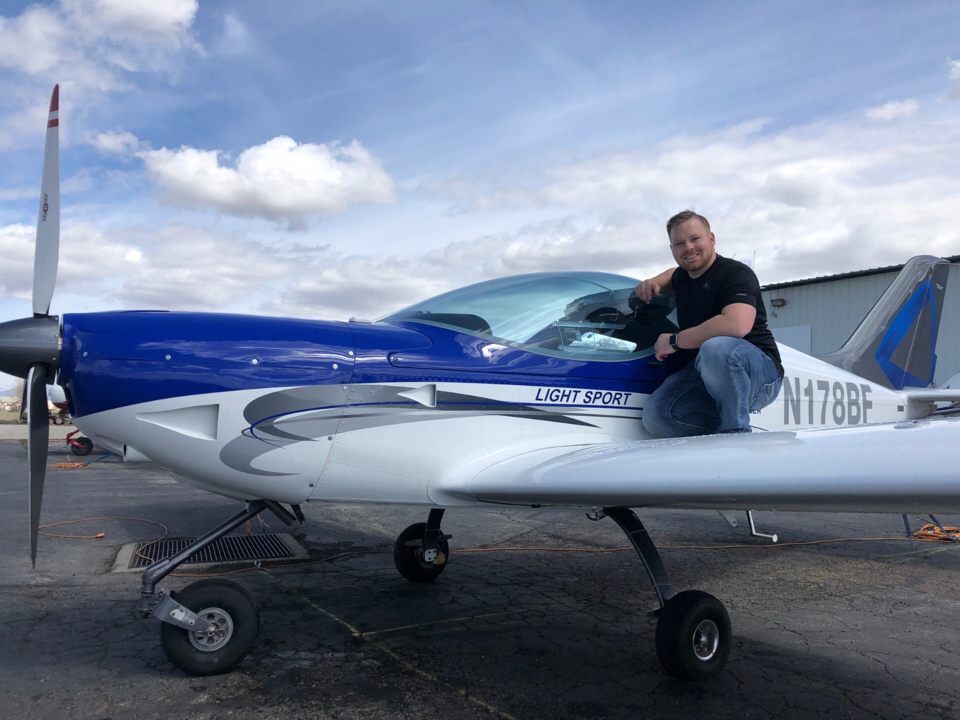 Man riding a plane image