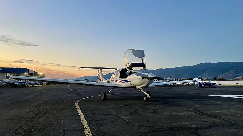 Small aircraft with open cockpit.
